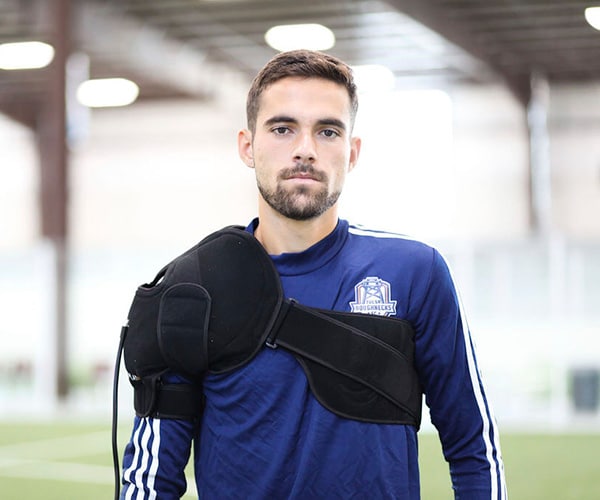 Soccer player using PowerPlay shoulder wrap